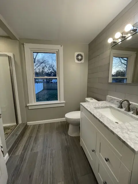 Full bath with new vanity and flooring