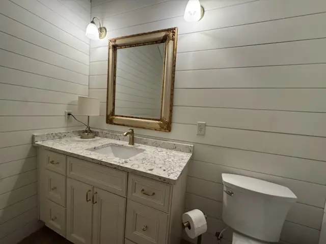 Half bath with shiplap walls